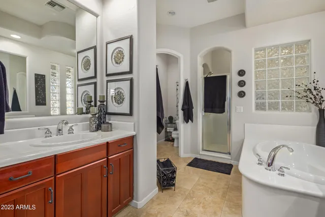 a living room with furniture and a ceiling fan