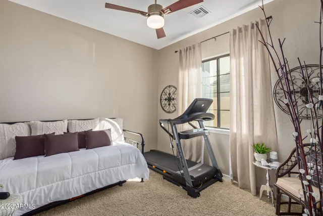 a view of a house with backyard porch and sitting area