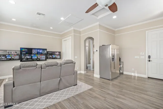 a view of a patio with a table and chairs under an umbrella