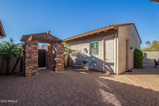 a front view of a house with outdoor seating