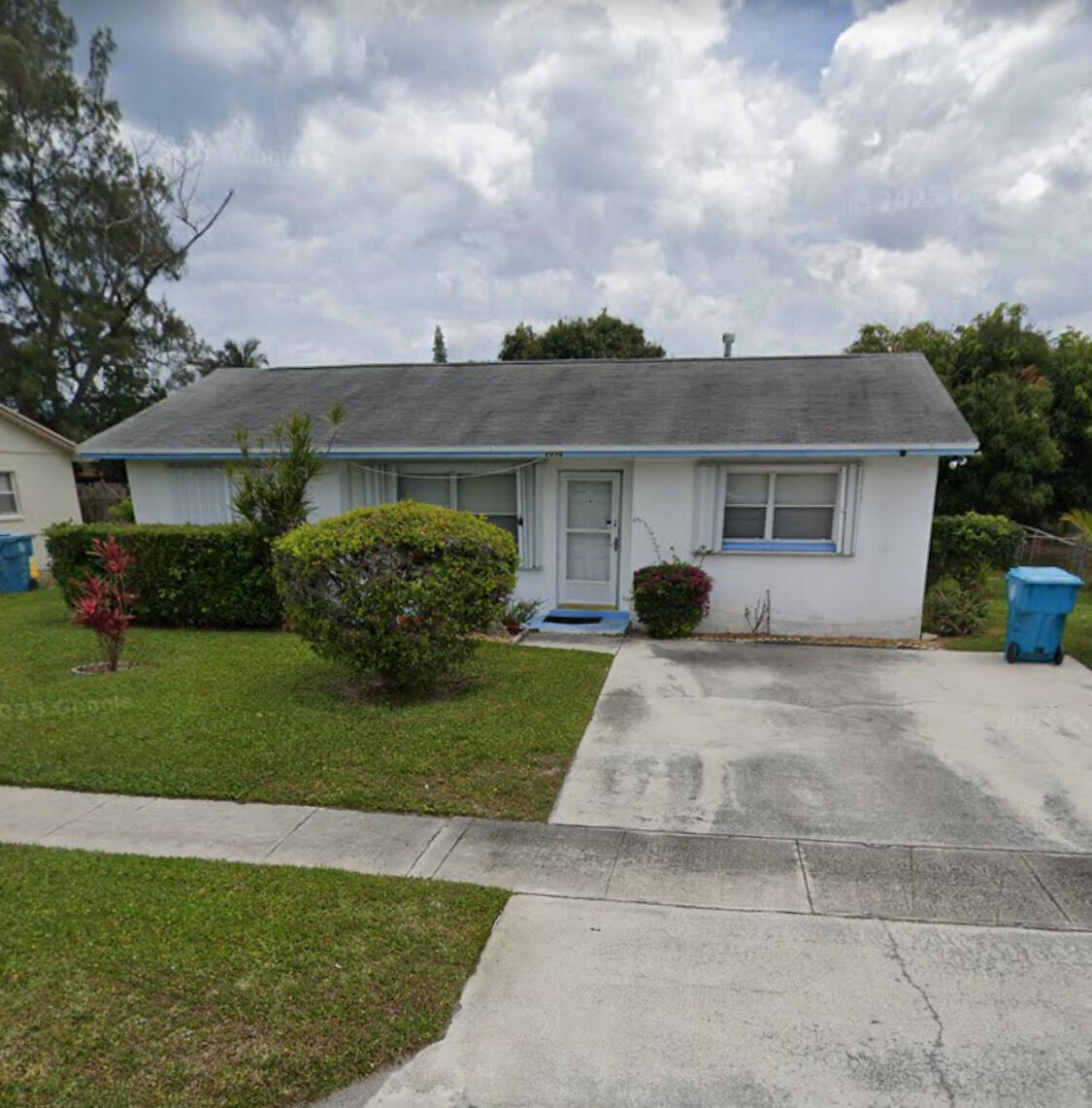 2030 Northeast 1st Lane Boynton Beach, FL 33435 - Photo 1 of 2 a view of a house with a garden