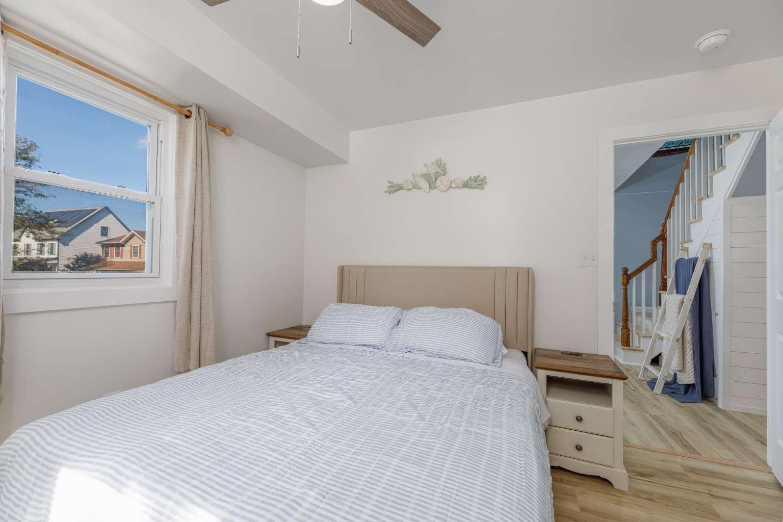 5 Kenvil Road North Cape May, NJ 08204 - Photo 13 of 19 a bedroom with a bed and painting on the wall