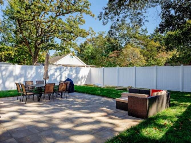 5 Kenvil Road North Cape May, NJ 08204 - Photo 15 of 19 a backyard of a house with barbeque oven and outdoor seating
