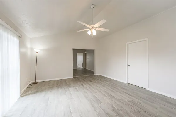 a view of an empty room with a window