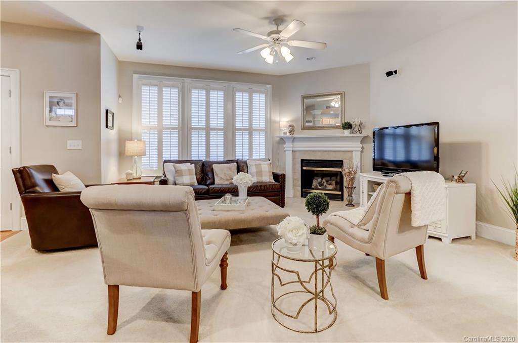3288 Richard's Crossing Fort Mill, SC 29708 - Photo 12 of 36 a living room with furniture a fireplace and a flat screen tv