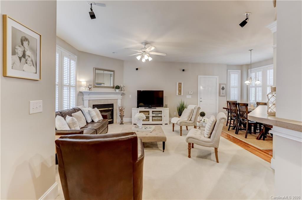 3288 Richard's Crossing Fort Mill, SC 29708 - Photo 13 of 36 a living room with furniture a flat screen tv and a fireplace