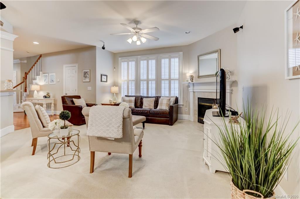 3288 Richard's Crossing Fort Mill, SC 29708 - Photo 14 of 36 a living room with furniture a fireplace and a potted plant
