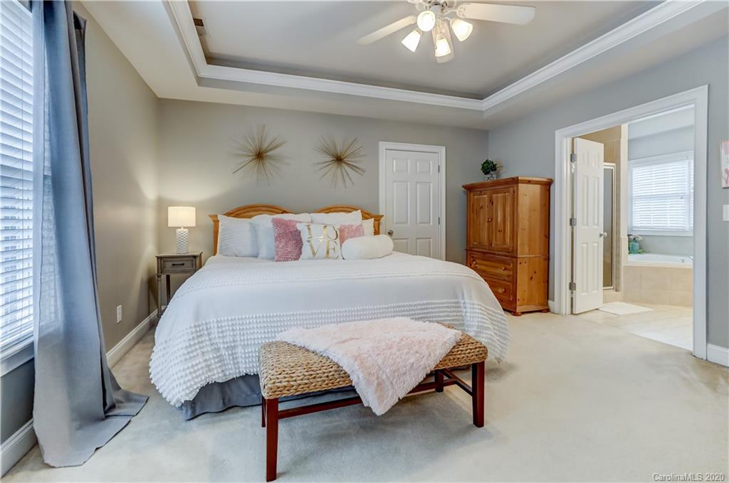 3288 Richard's Crossing Fort Mill, SC 29708 - Photo 17 of 36 a bedroom with a bed and a chandelier