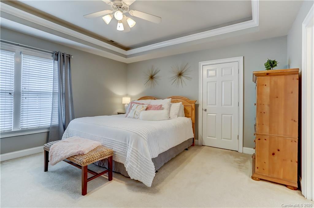 3288 Richard's Crossing Fort Mill, SC 29708 - Photo 18 of 36 a bedroom with a bed and a chandelier