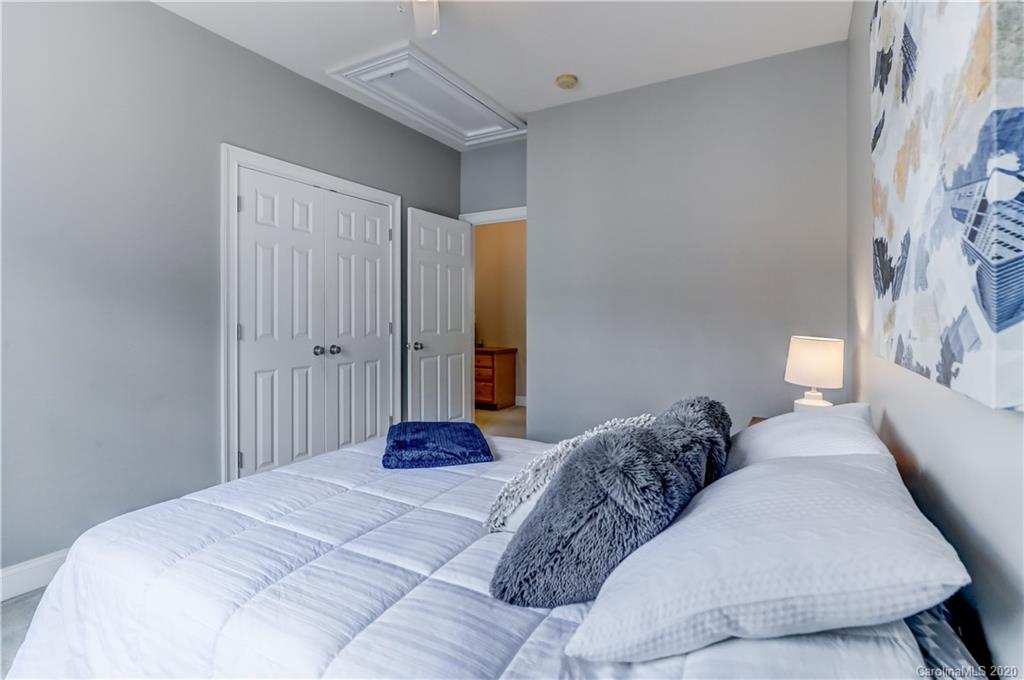 3288 Richard's Crossing Fort Mill, SC 29708 - Photo 25 of 36 a bedroom with a bed and a lamp