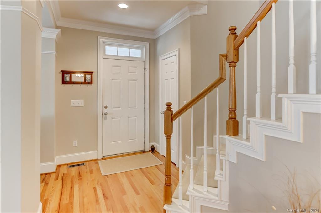 3288 Richard's Crossing Fort Mill, SC 29708 - Photo 6 of 36 a view of a bedroom with wooden floor and staircase
