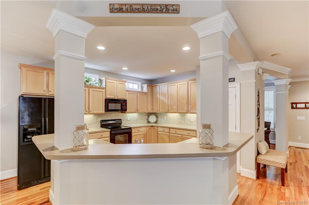 3288 Richard's Crossing Fort Mill, SC 29708 - Photo 10 of 36 a kitchen with stainless steel appliances granite countertop a sink a stove and a refrigerator