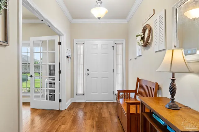 a view of a livingroom with furniture and a window