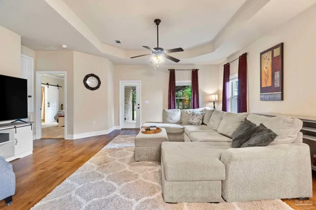 a living room with furniture and a flat screen tv