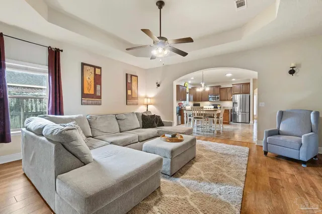 a living room with furniture and a large window