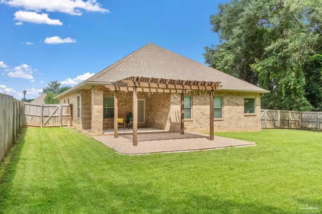 a view of a backyard of the house