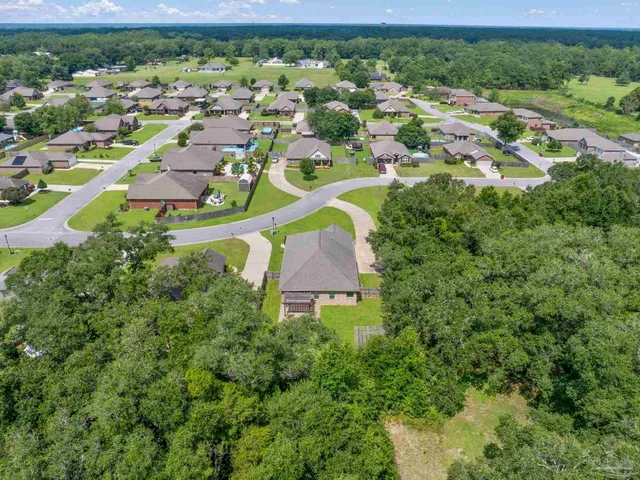 an aerial view of a house with a garden