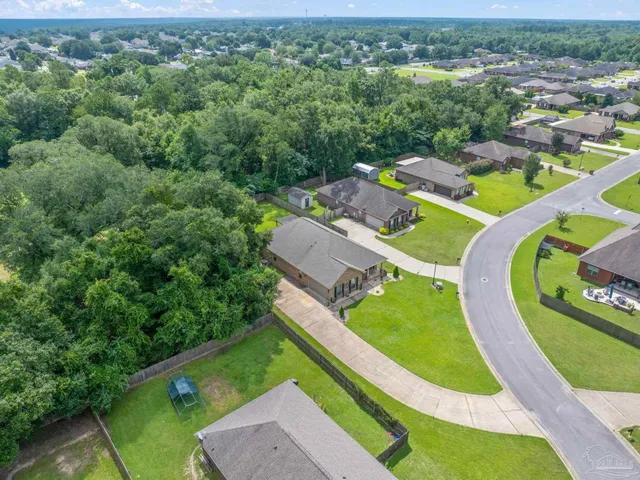 a view of a swimming pool with a yard and mountain view