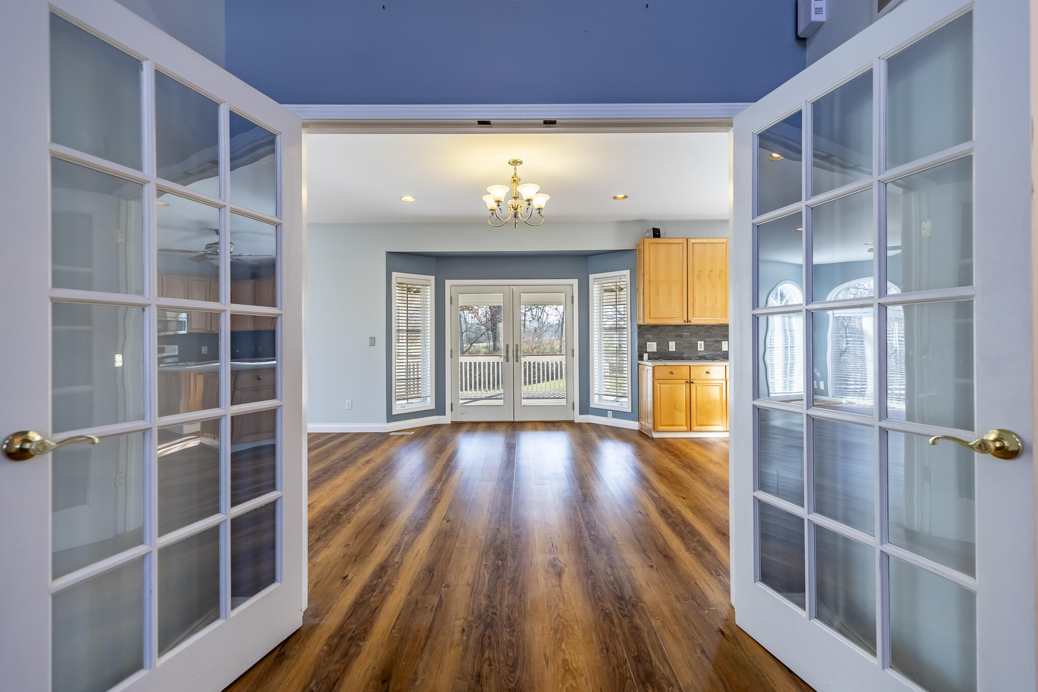 8049 West 85th Court Crown Point, IN 46307 - Photo 19 of 47 walk in closet with wooden floor and windows