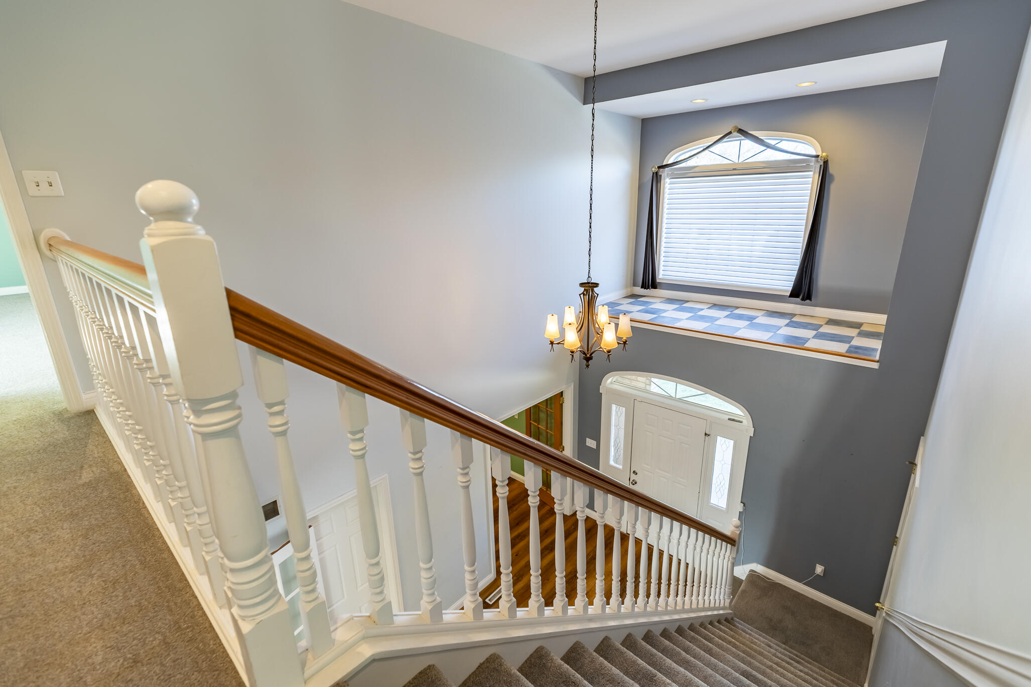 8049 West 85th Court Crown Point, IN 46307 - Photo 27 of 47 a view of a livingroom with wooden floor and stairs