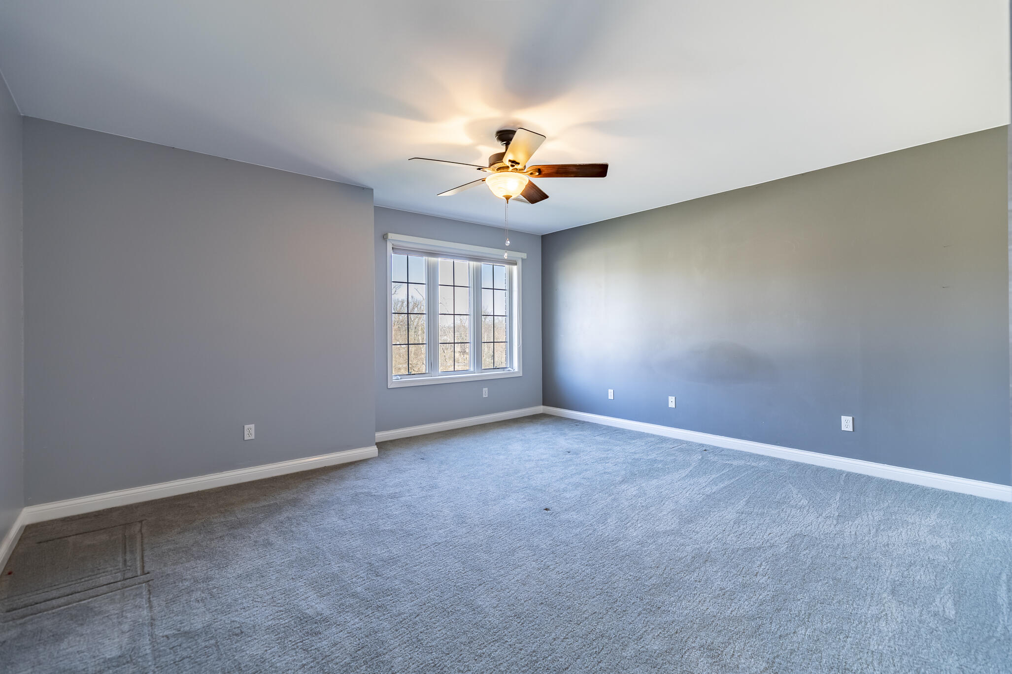8049 West 85th Court Crown Point, IN 46307 - Photo 32 of 47 an empty room with windows and fan