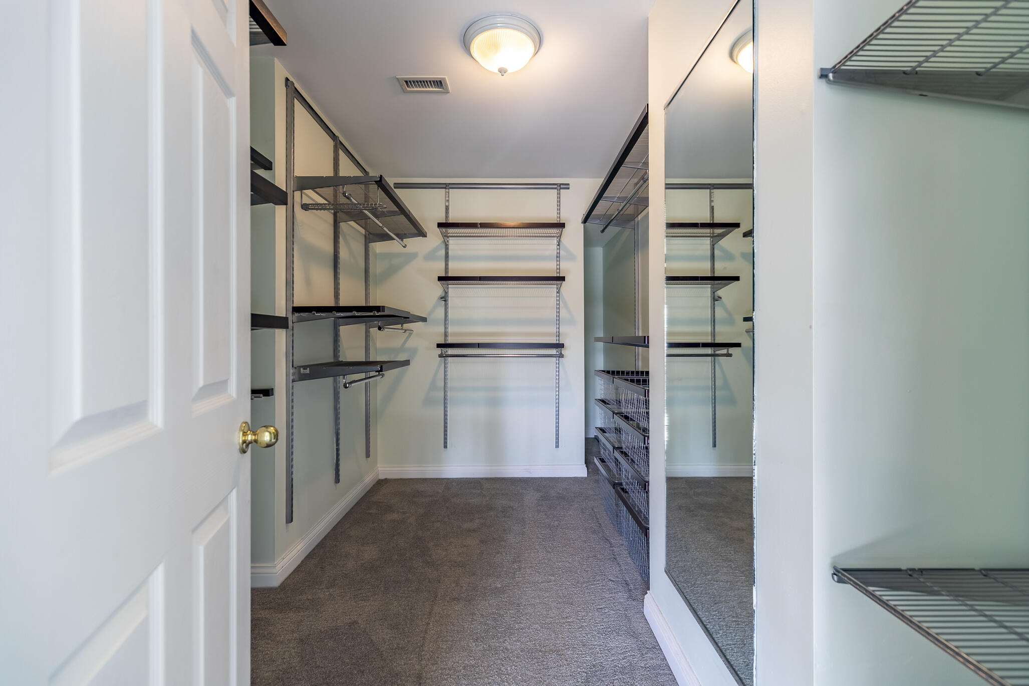 8049 West 85th Court Crown Point, IN 46307 - Photo 33 of 50 a view of walk in closet with empty racks