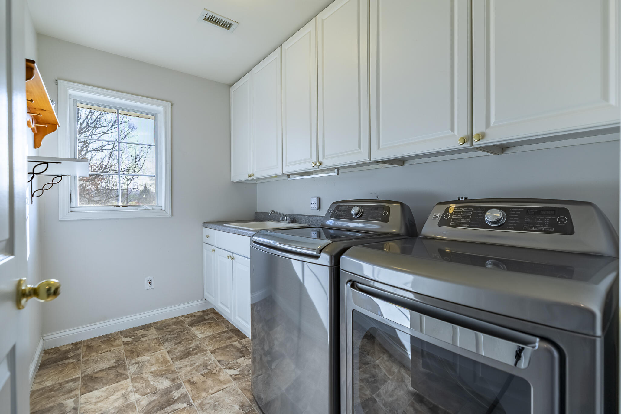 8049 West 85th Court Crown Point, IN 46307 - Photo 35 of 47 a utility room with stainless steel appliances granite countertop a sink stove and cabinets