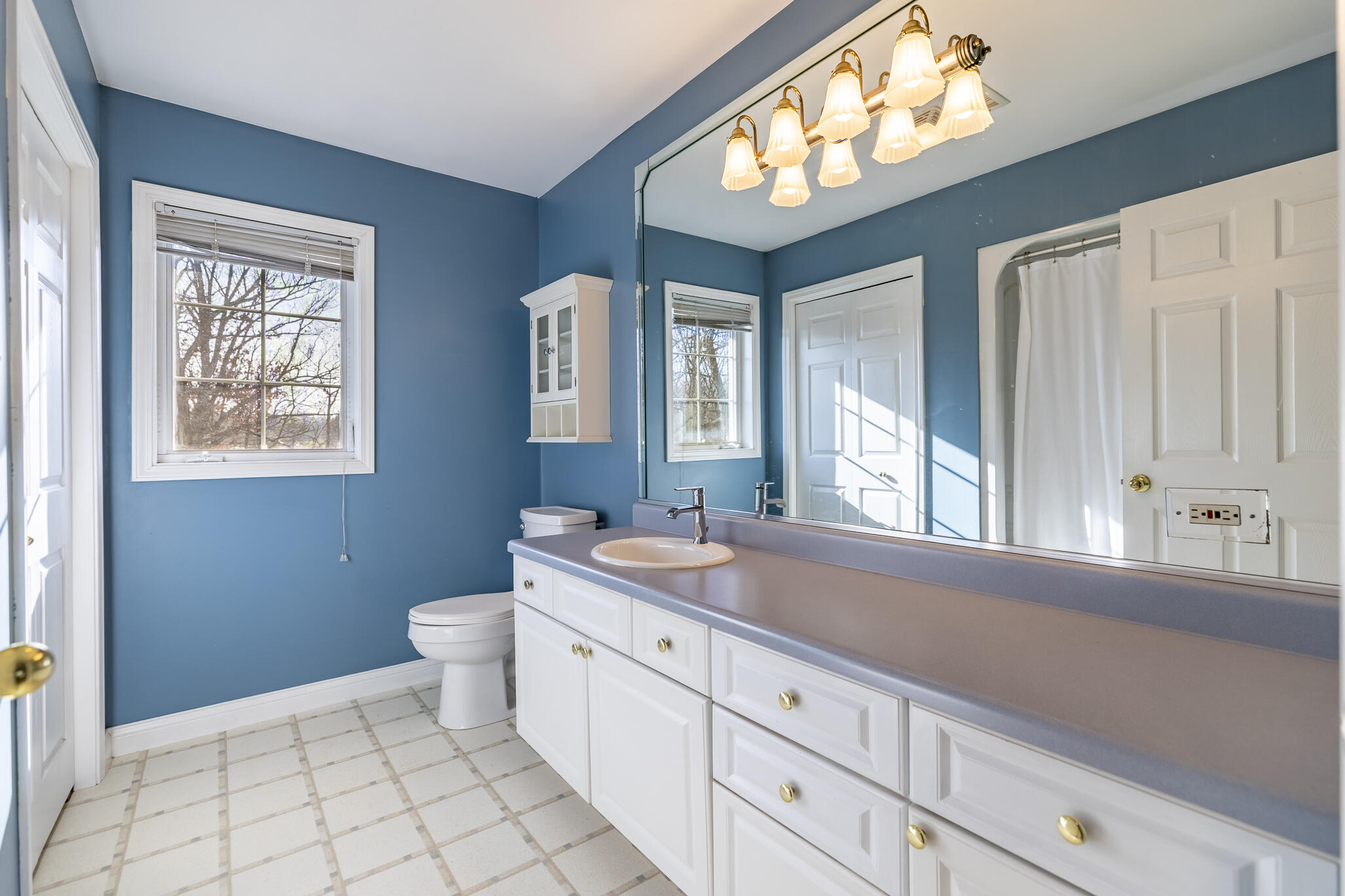 8049 West 85th Court Crown Point, IN 46307 - Photo 35 of 50 a spacious bathroom with 2 sink and a mirror