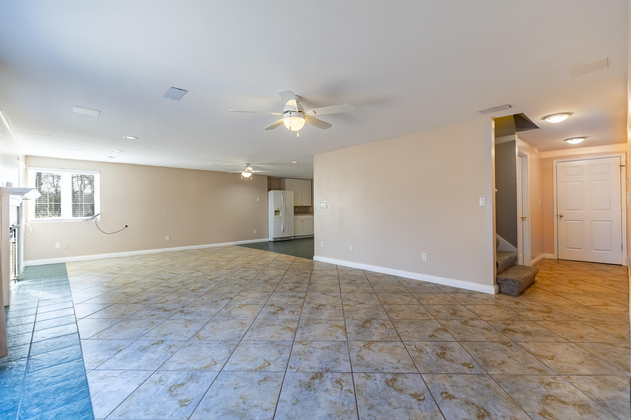 8049 West 85th Court Crown Point, IN 46307 - Photo 38 of 50 a view of an empty room with a ceiling fan