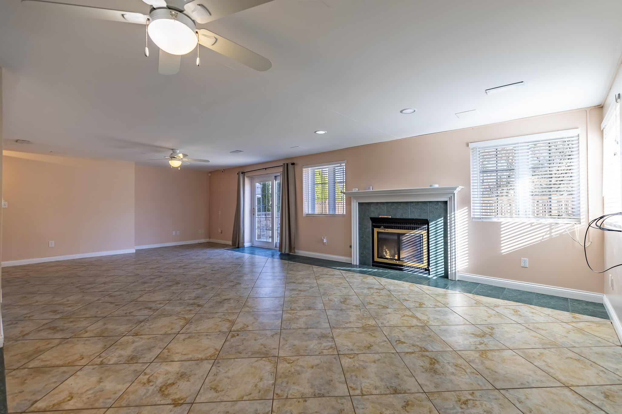 8049 West 85th Court Crown Point, IN 46307 - Photo 40 of 50 a view of an empty room with a fireplace and a window