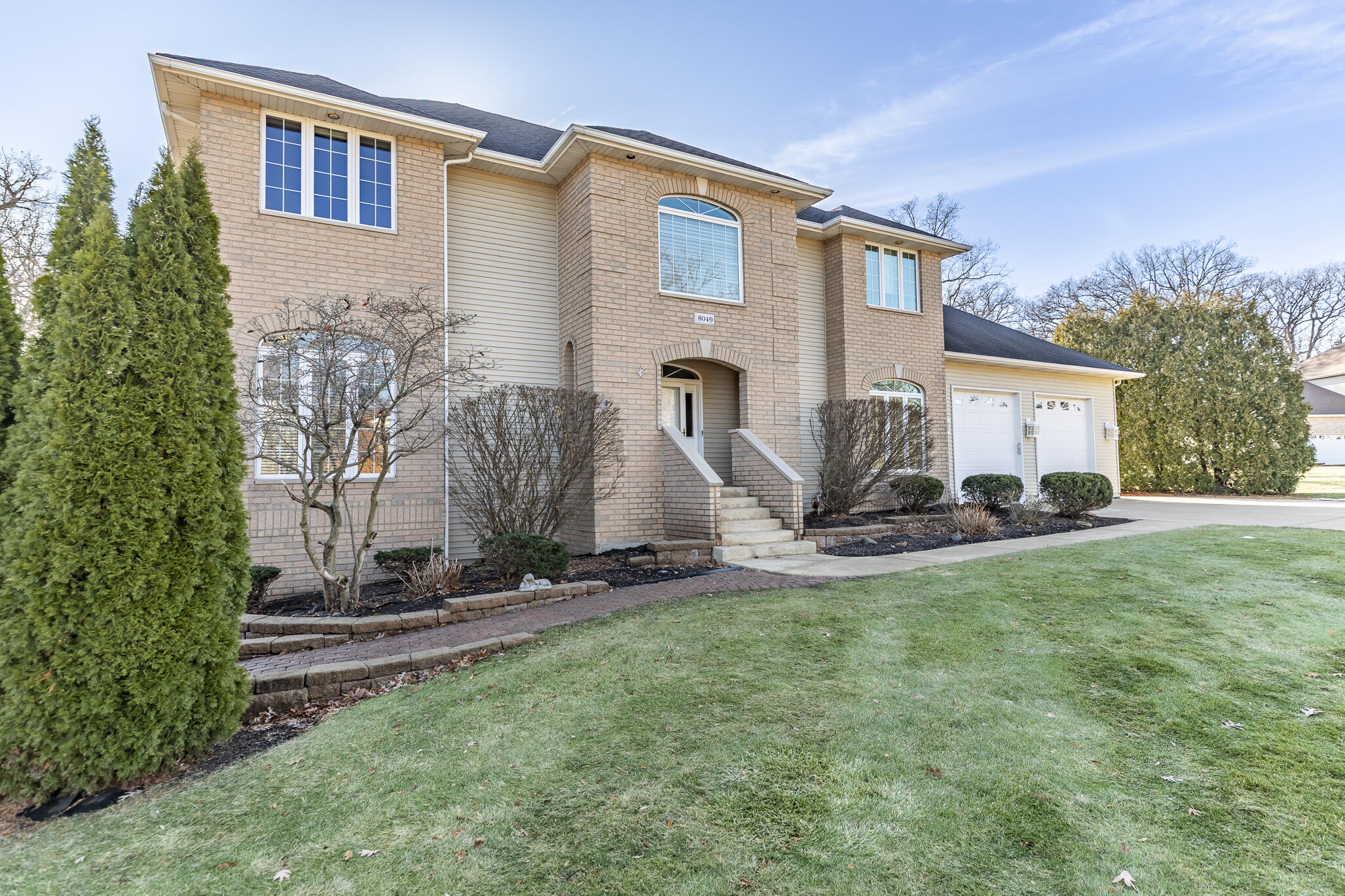 8049 West 85th Court Crown Point, IN 46307 - Photo 4 of 47 a view of a house with backyard and a tree