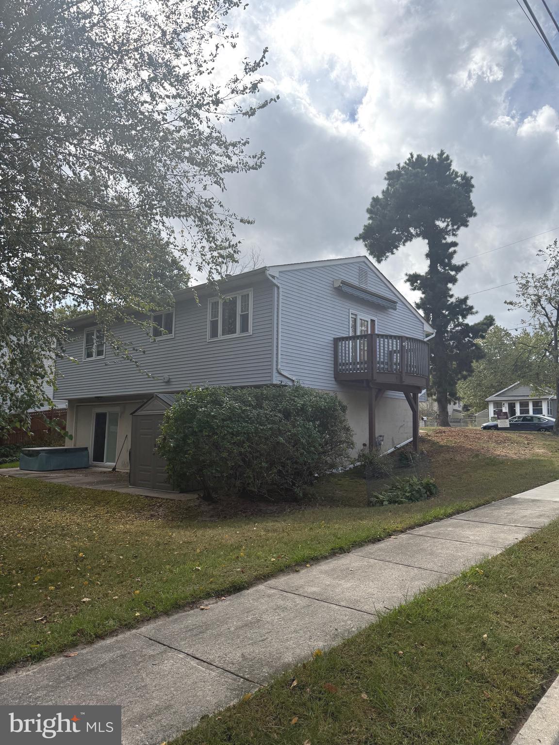 403 Roosevelt Avenue Clementon, NJ 08021 - Photo 17 of 26 a front view of a house with a garden and trees