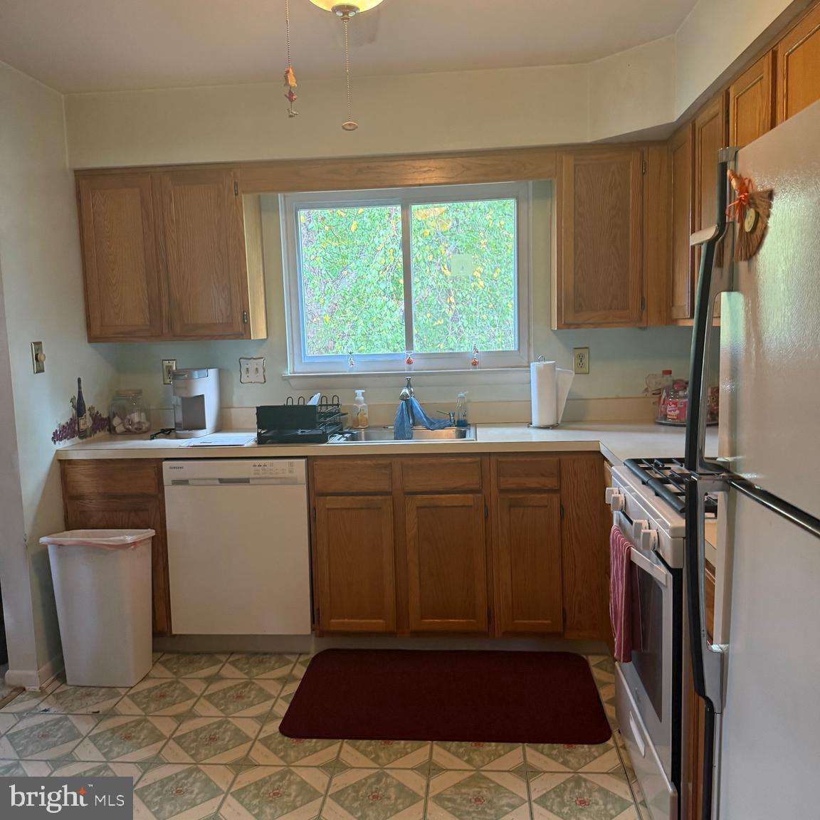 403 Roosevelt Avenue Clementon, NJ 08021 - Photo 7 of 26 a kitchen with a sink cabinets and appliances