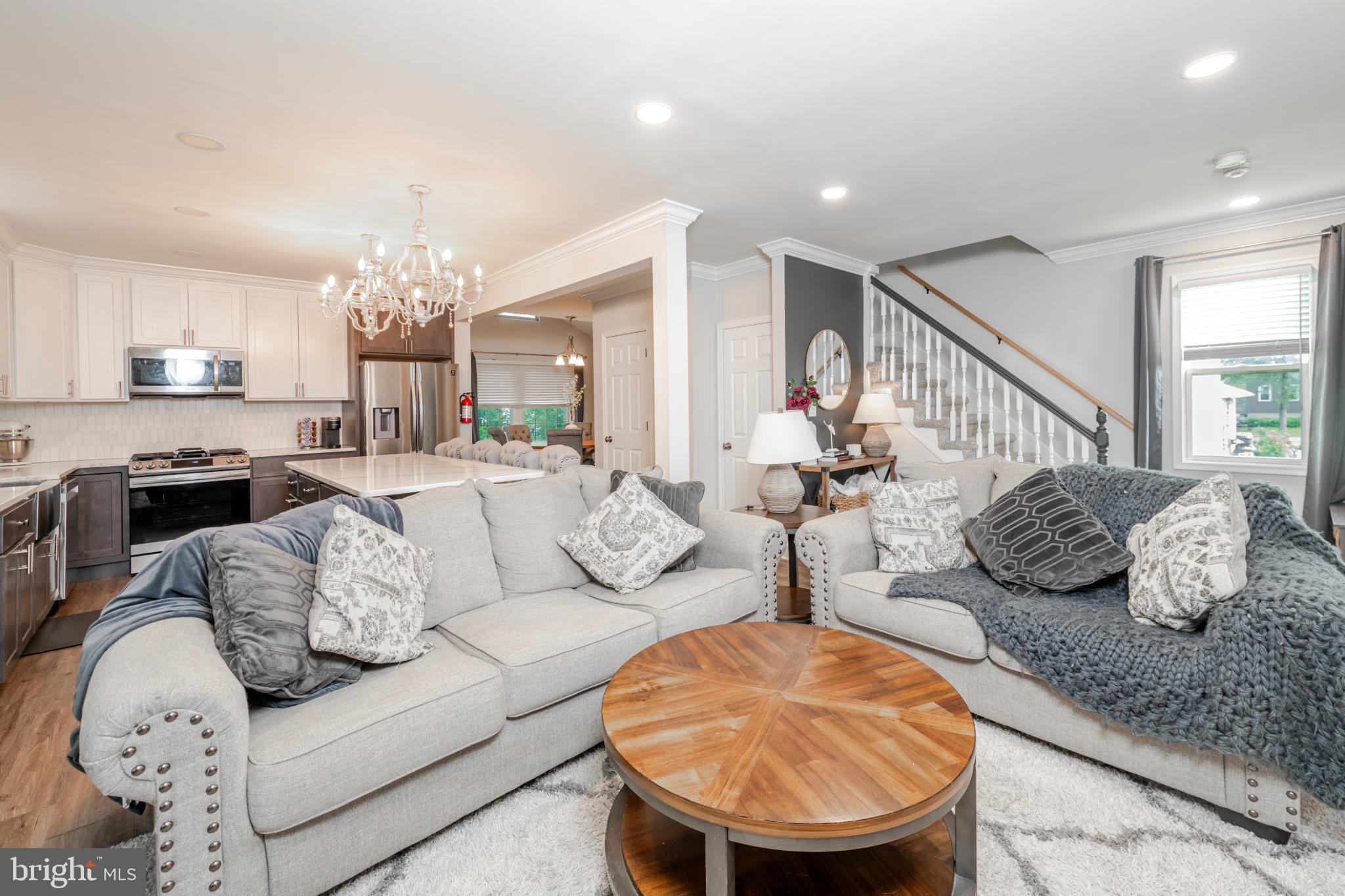 16 Townsend Avenue Berlin, NJ 08009 - Photo 12 of 50 a living room with furniture and a chandelier
