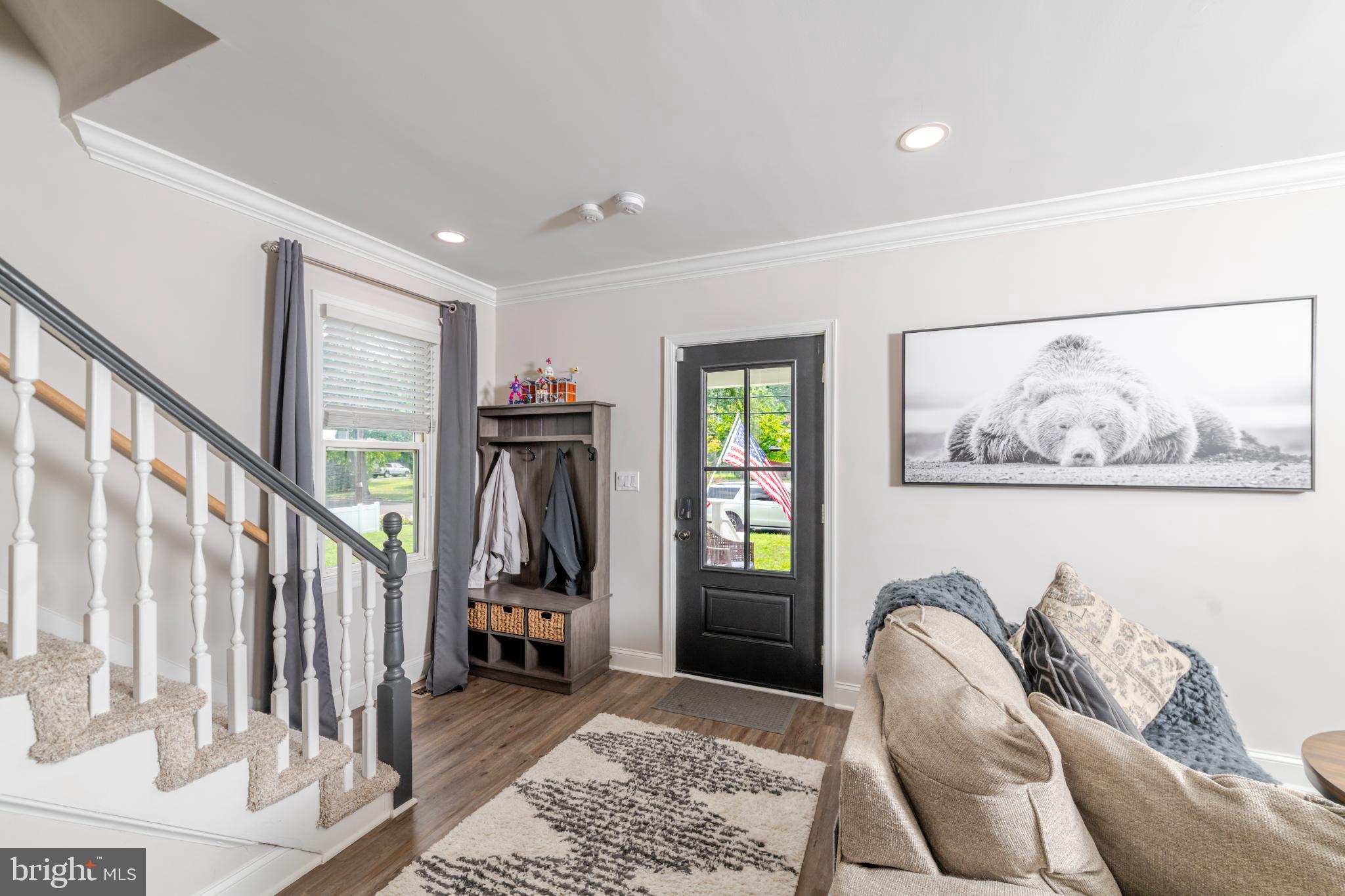 16 Townsend Avenue Berlin, NJ 08009 - Photo 17 of 50 a living room with furniture a rug and a painting