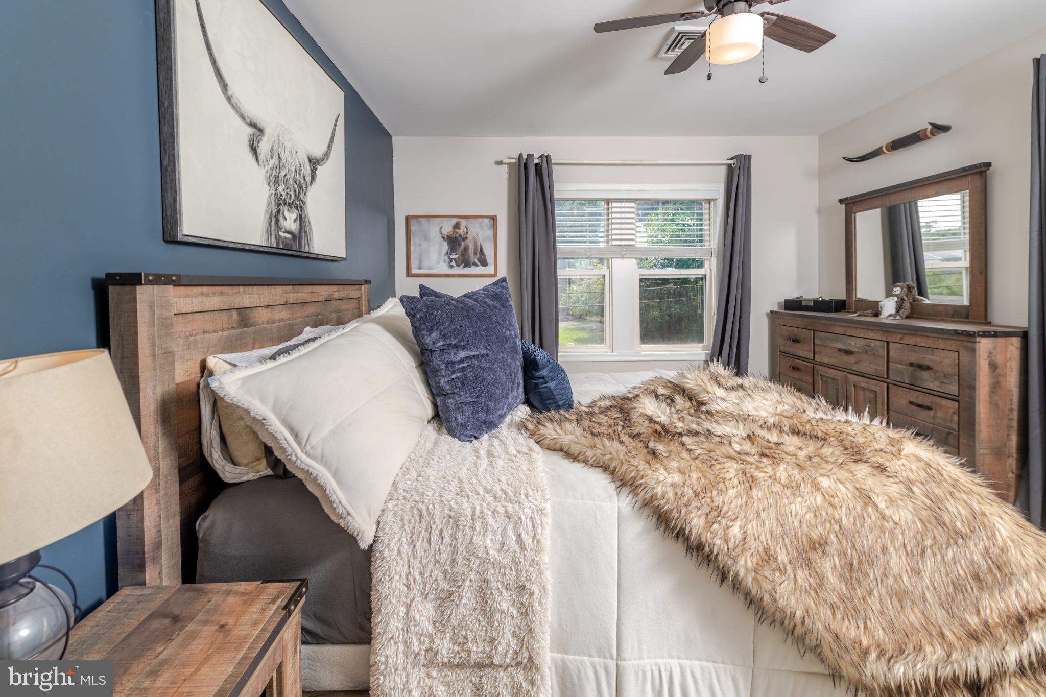 16 Townsend Avenue Berlin, NJ 08009 - Photo 23 of 50 a bed sitting in a bedroom and chair next to a window