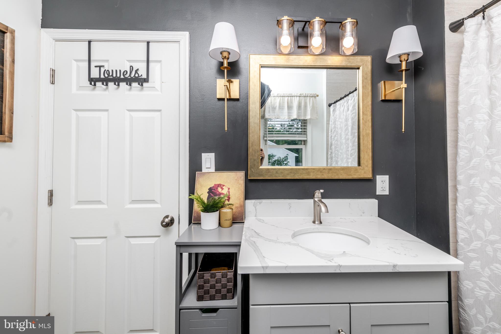 16 Townsend Avenue Berlin, NJ 08009 - Photo 30 of 50 a bathroom with a sink and a mirror