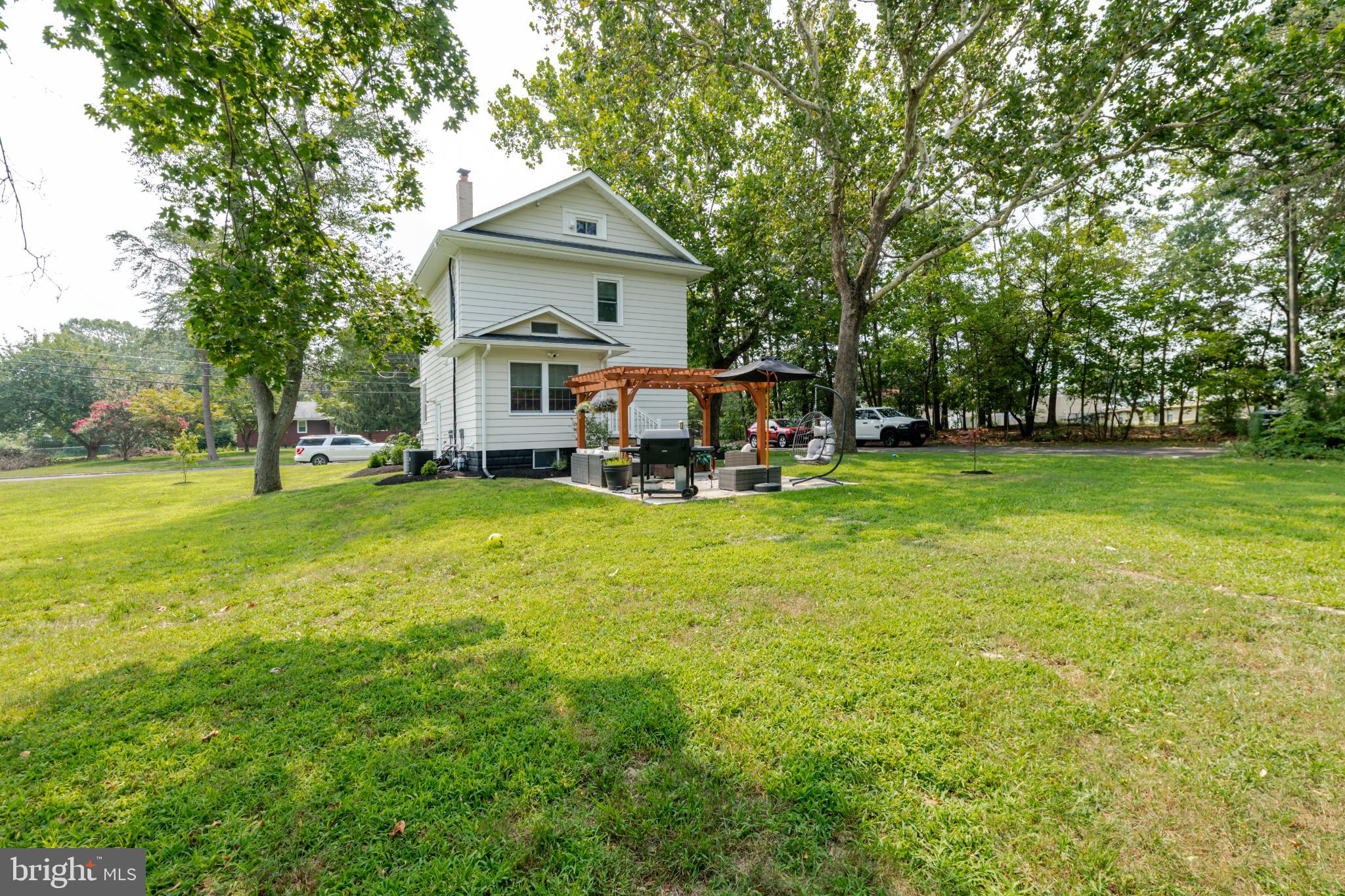 16 Townsend Avenue Berlin, NJ 08009 - Photo 31 of 50 a front view of a house with garden and trees