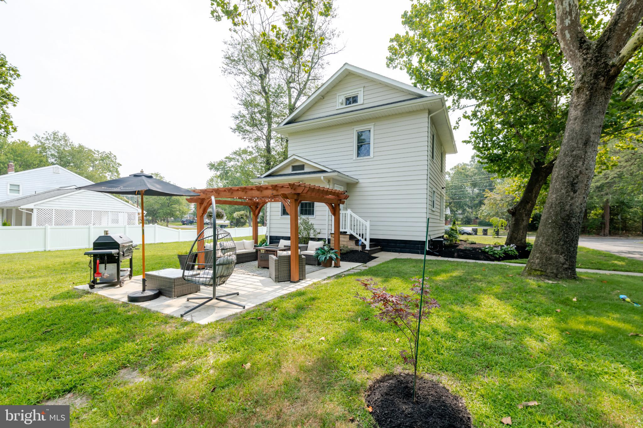 16 Townsend Avenue Berlin, NJ 08009 - Photo 38 of 50 a front view of house with yard and outdoor seating