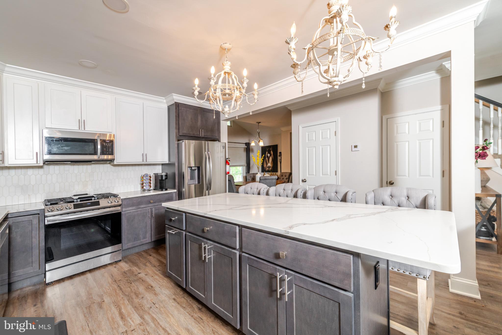 16 Townsend Avenue Berlin, NJ 08009 - Photo 5 of 50 a kitchen with a sink stove and microwave