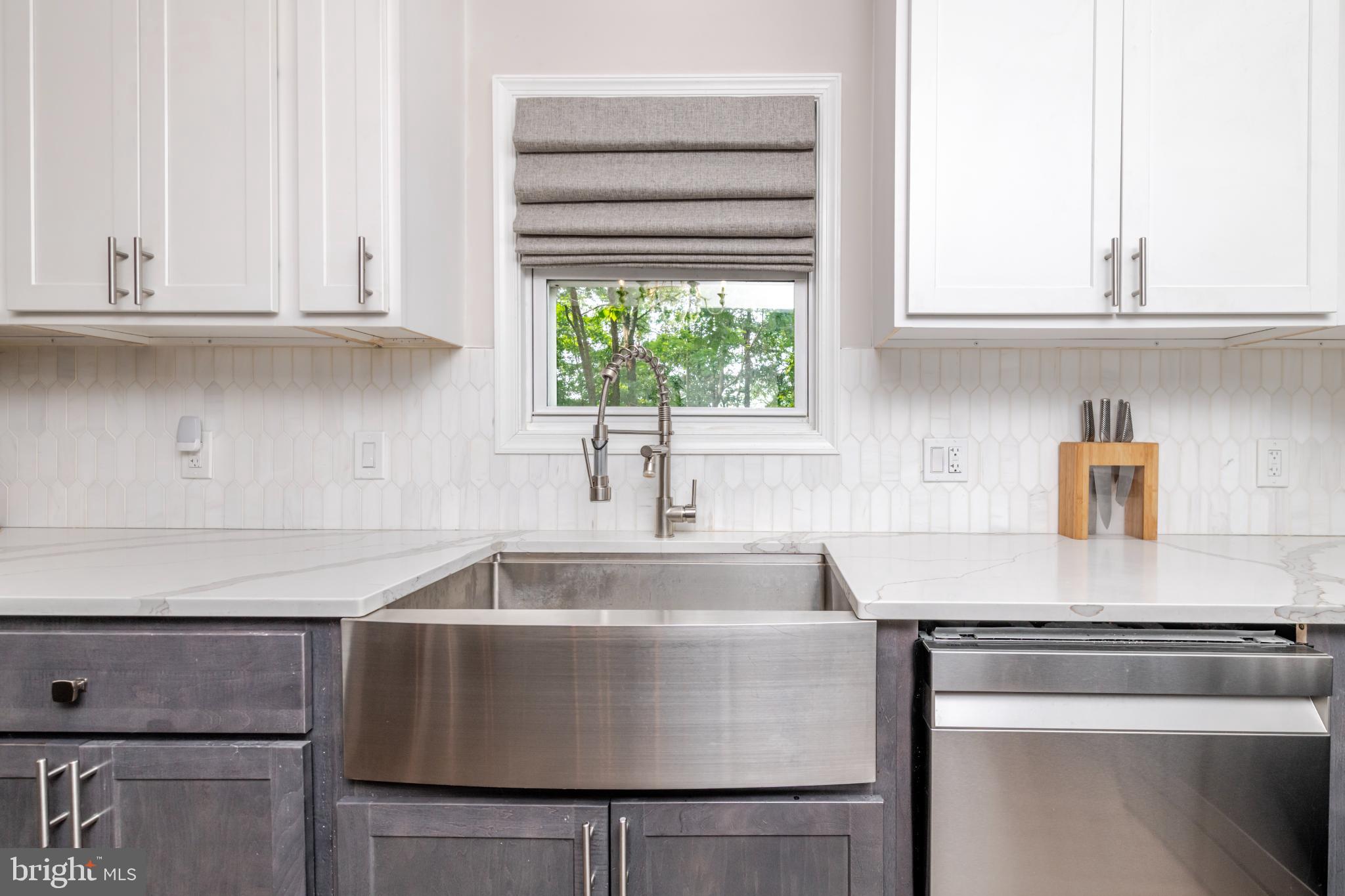 16 Townsend Avenue Berlin, NJ 08009 - Photo 6 of 50 a kitchen with granite countertop white cabinets and a sink