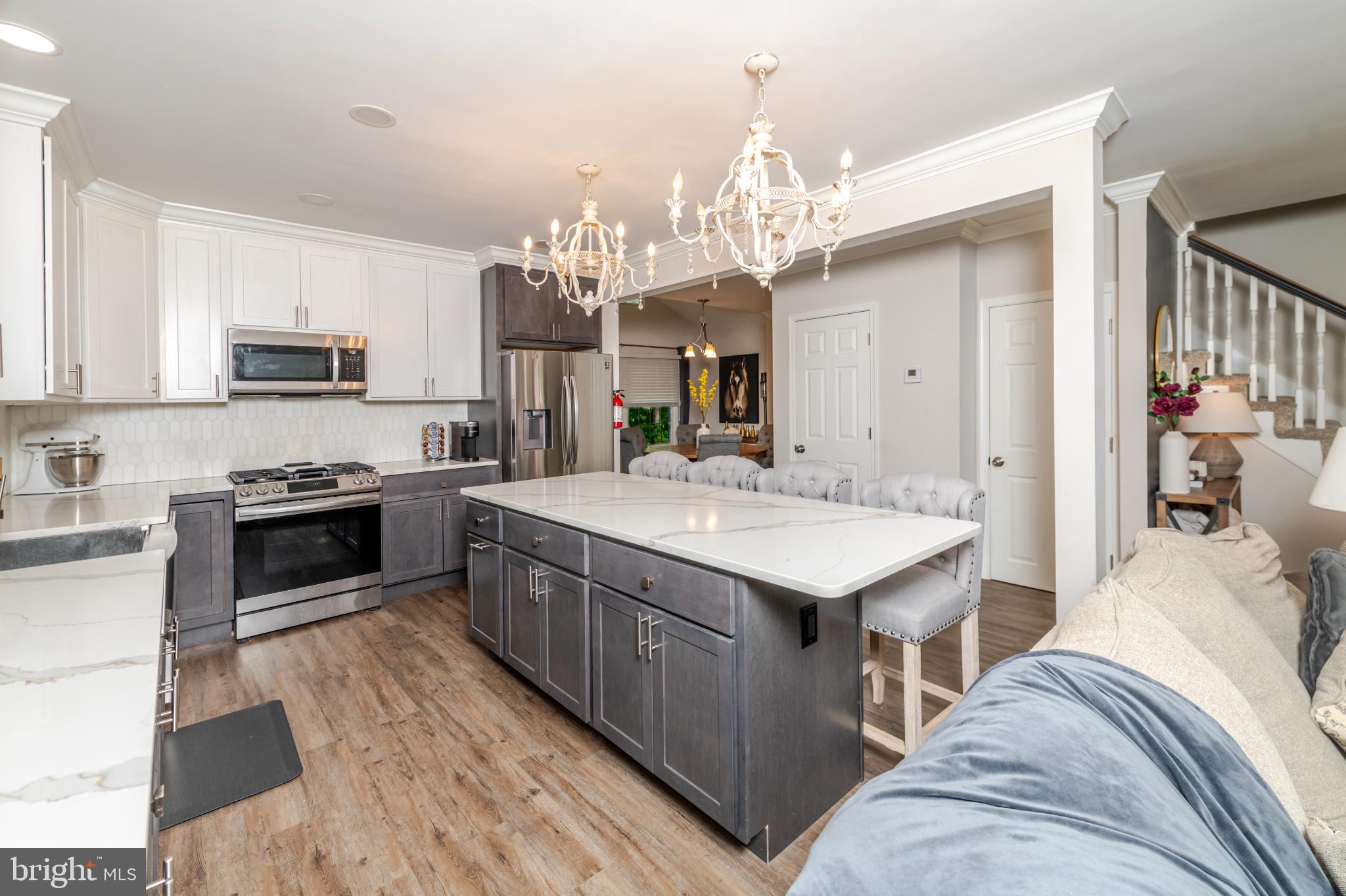16 Townsend Avenue Berlin, NJ 08009 - Photo 10 of 50 a kitchen with a sink stove and cabinets