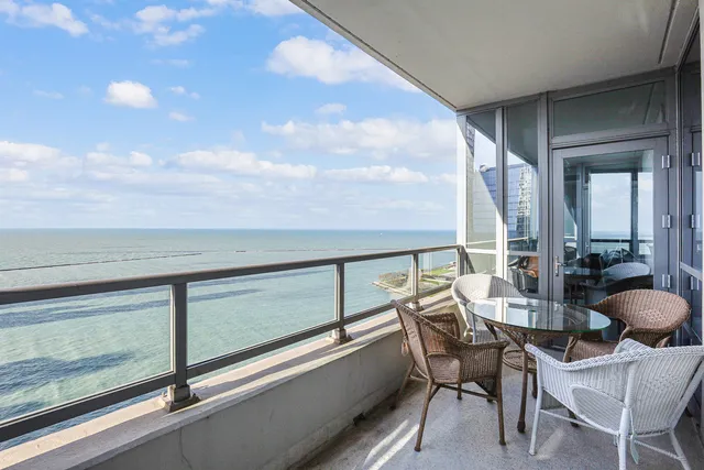 a view of balcony with furniture