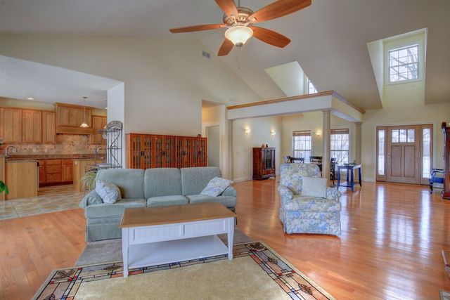 8038 Adam Road Weldon, IL 61882 - Photo 13 of 53 a living room with furniture and wooden floor