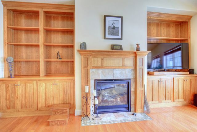 8038 Adam Road Weldon, IL 61882 - Photo 15 of 53 a view of a livingroom with a fireplace and cabinet