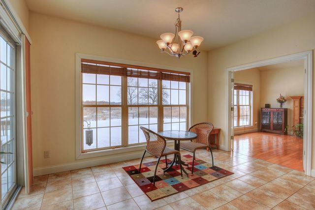 8038 Adam Road Weldon, IL 61882 - Photo 20 of 53 a living room with furniture and a chandelier