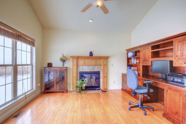 8038 Adam Road Weldon, IL 61882 - Photo 23 of 53 a workspace with furniture hardwood and a window