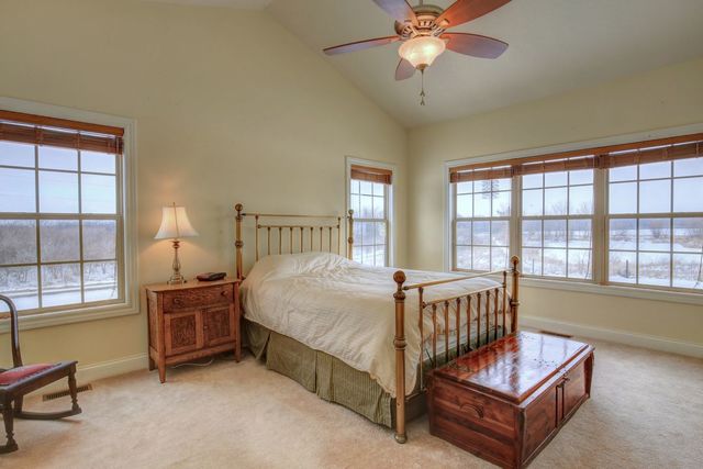8038 Adam Road Weldon, IL 61882 - Photo 25 of 53 a bedroom with a bed window and a dresser in it