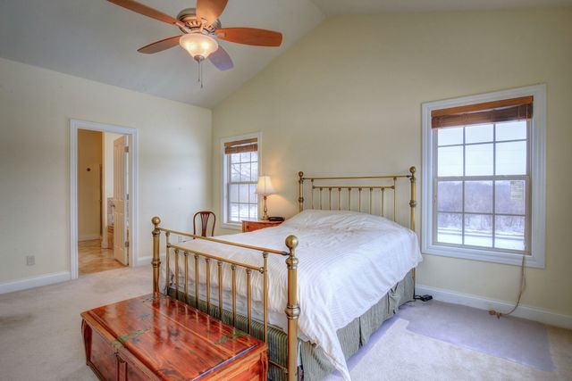 8038 Adam Road Weldon, IL 61882 - Photo 26 of 53 a bedroom with a bed and a window