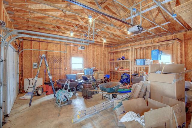 8038 Adam Road Weldon, IL 61882 - Photo 37 of 53 a living room with furniture and a chandelier